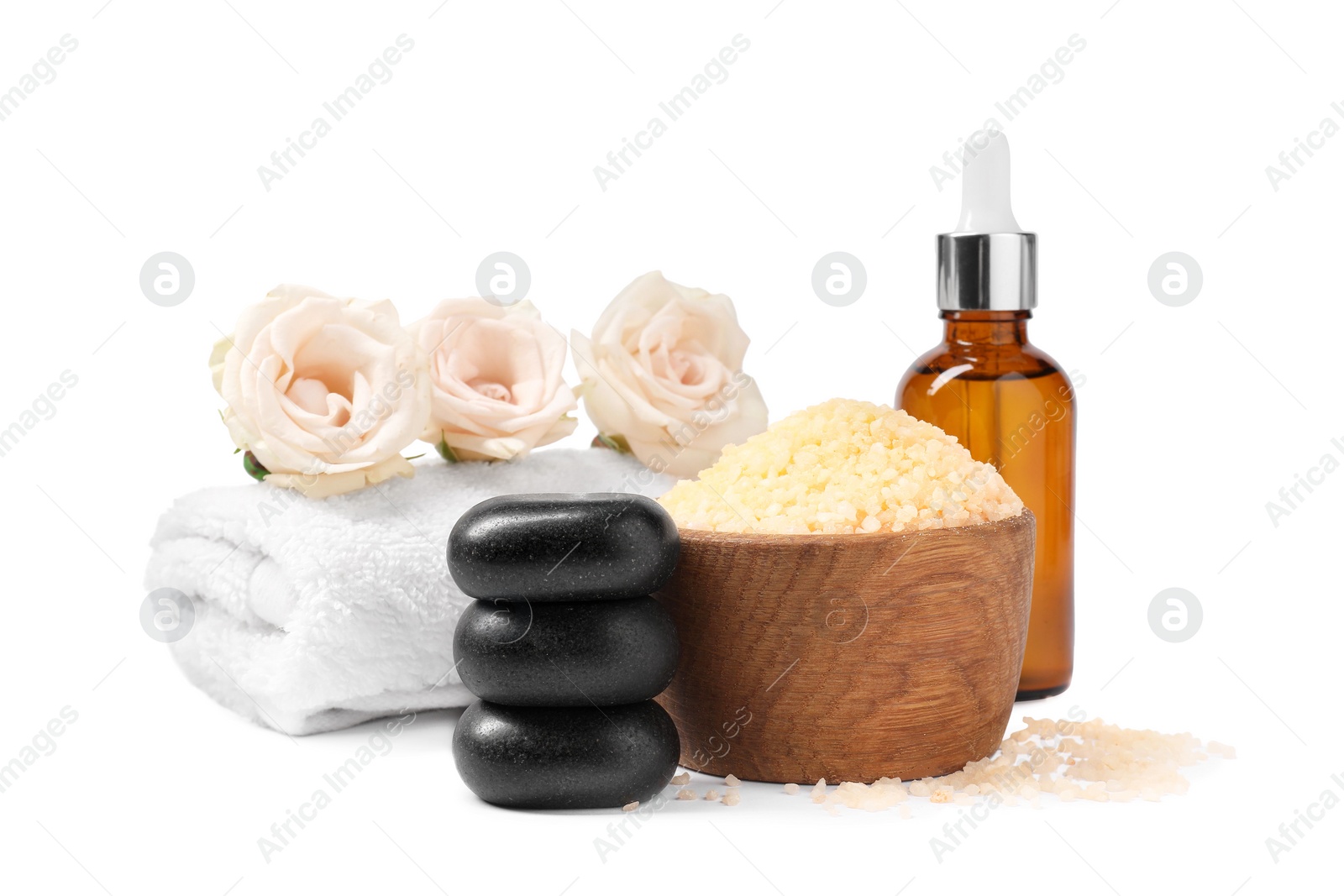 Photo of Orange sea salt in bowl and other spa supplies isolated on white