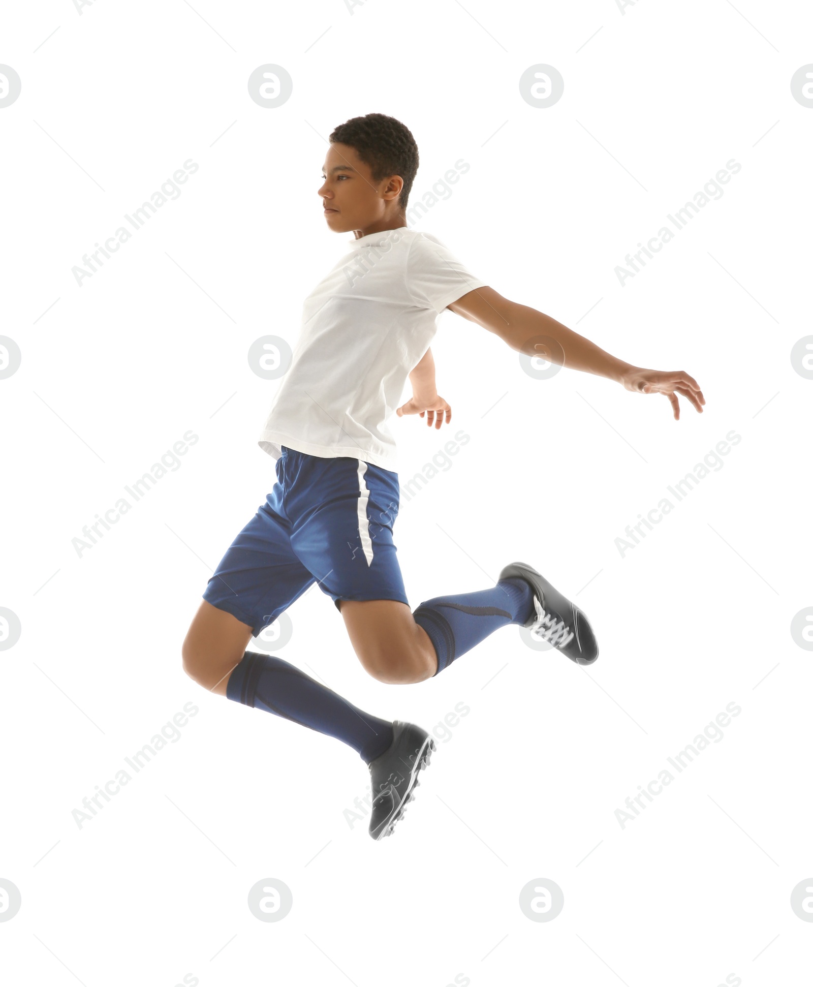 Photo of Teenage African-American boy playing football on white background