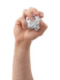 Photo of Man crumpling paper against white background, closeup. Generating idea