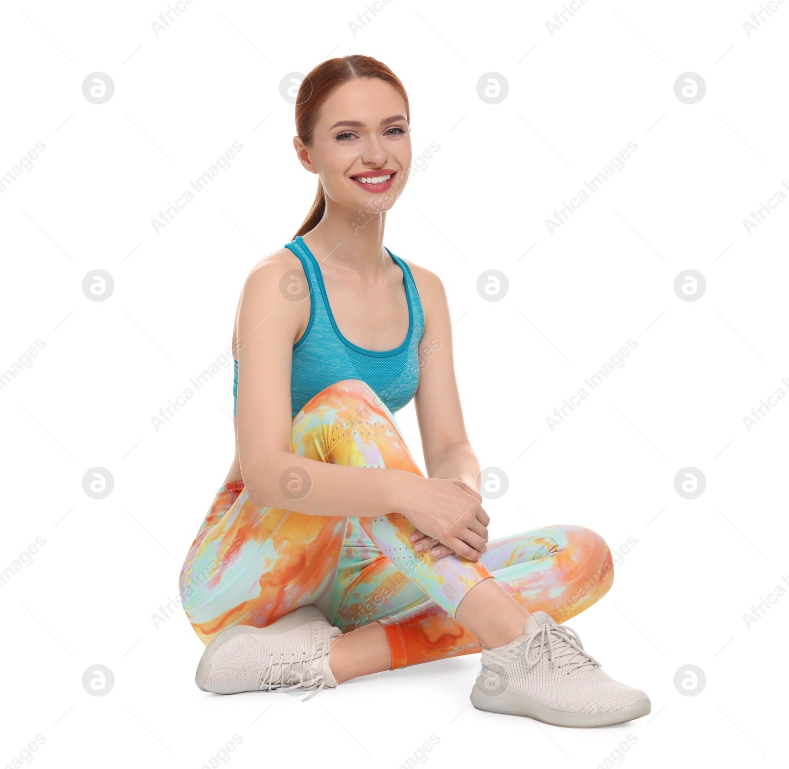 Photo of Young woman wearing sportswear on white background