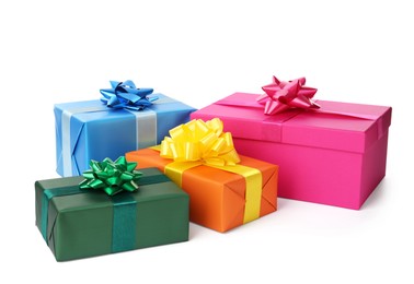 Photo of Colorful gift boxes with bows on white background