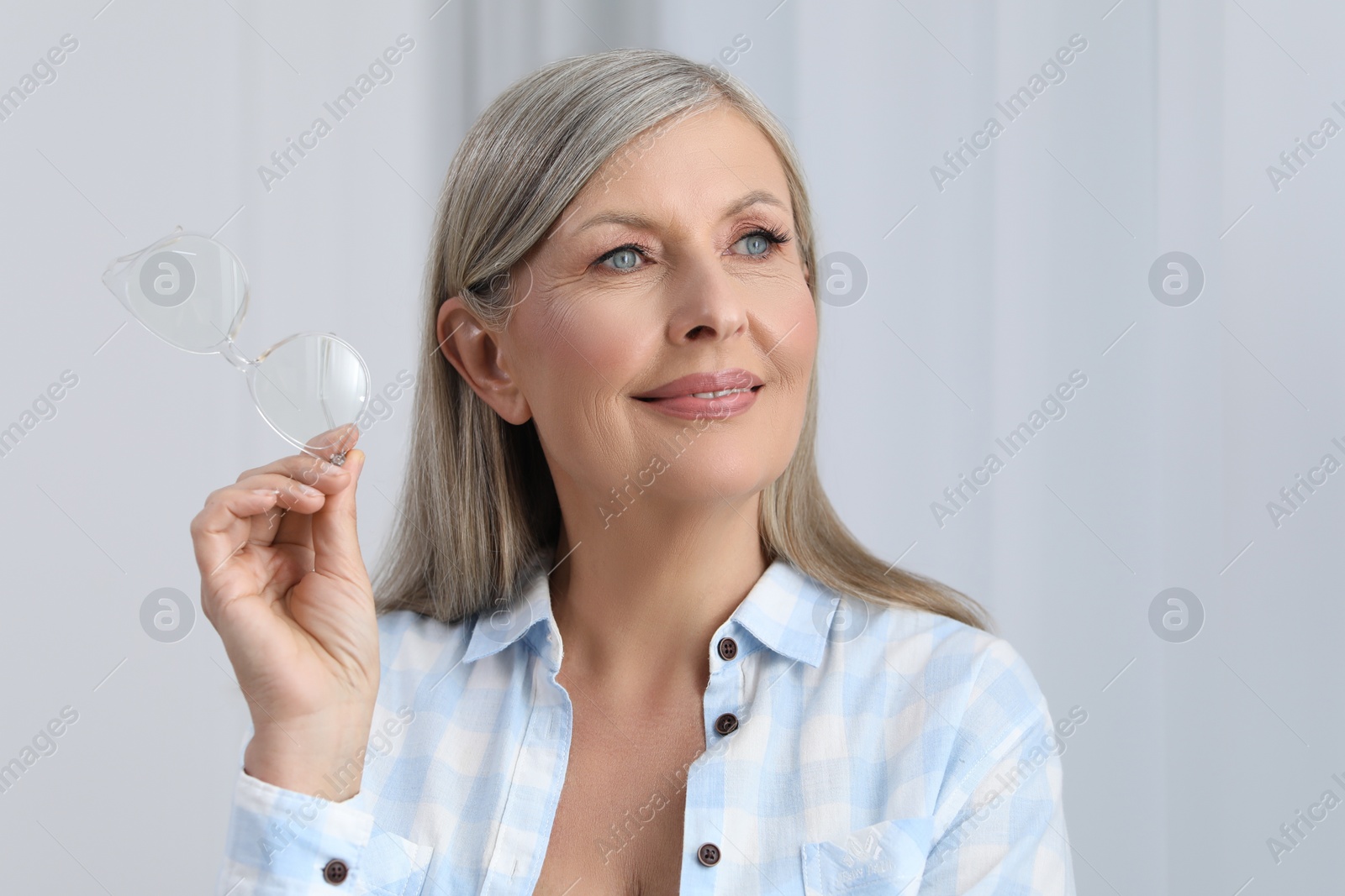 Photo of Portrait of beautiful senior woman with gray hair indoors