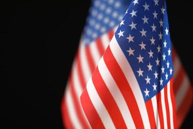Photo of American flag on black background, closeup with space for text. Memorial Day