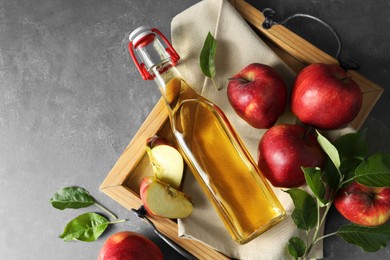 Photo of Flat lay composition with delicious apple cider on gray table