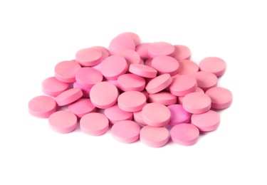 Photo of Pile of pink pills on white background