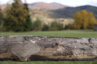 Closeup view of old wooden fence outdoors