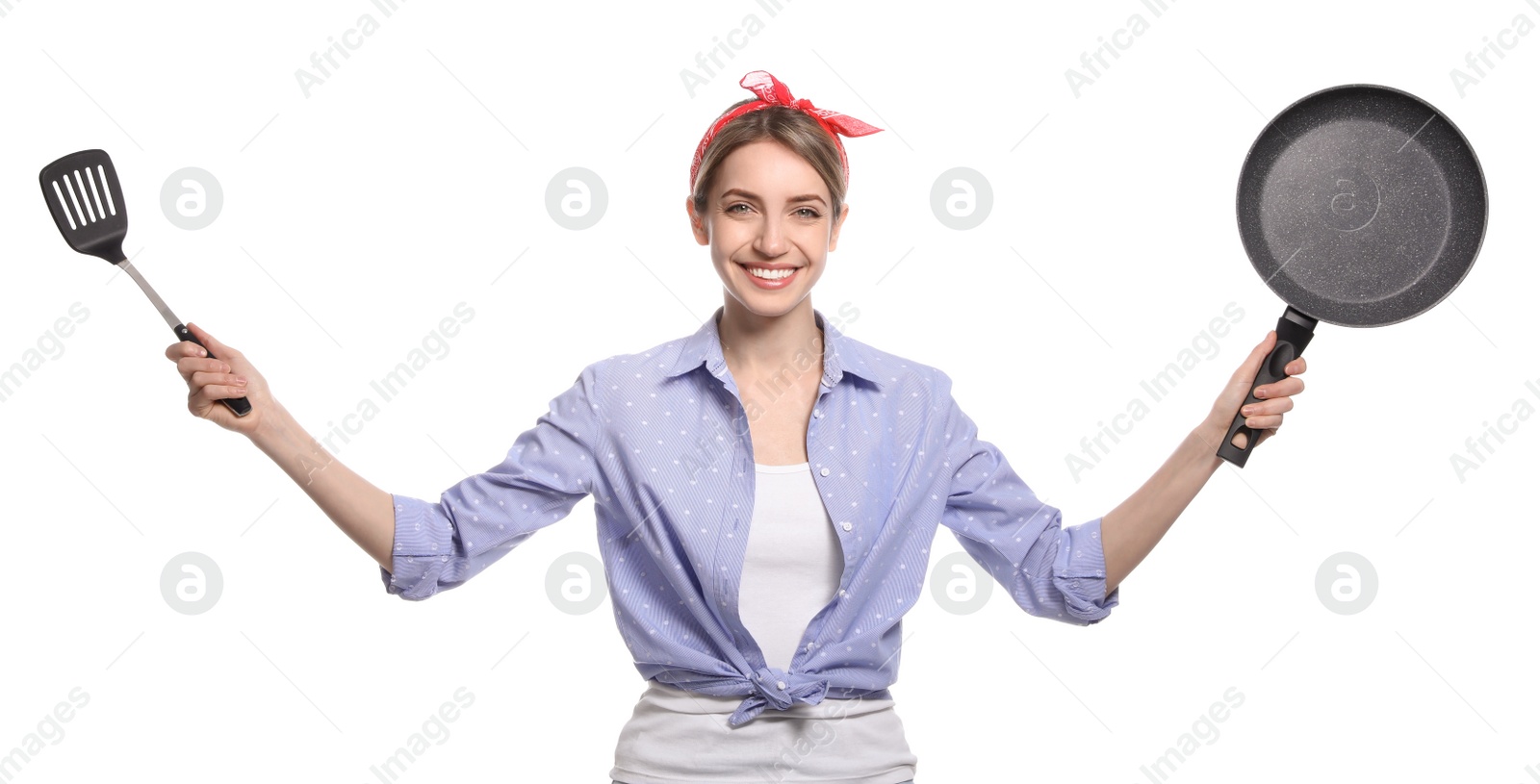 Photo of Young housewife with frying pan and spatula on white background