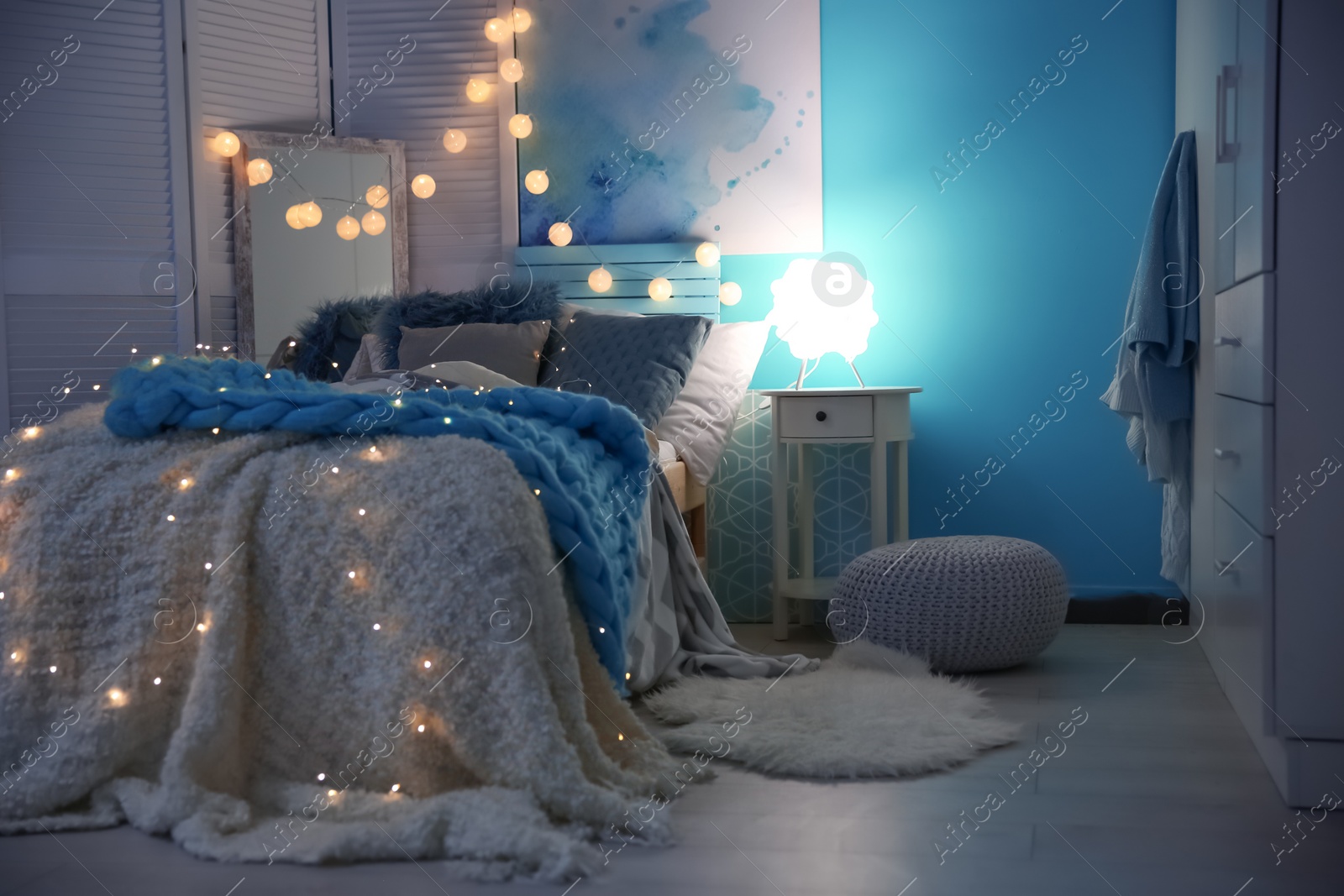 Photo of Cozy room interior with comfortable bed