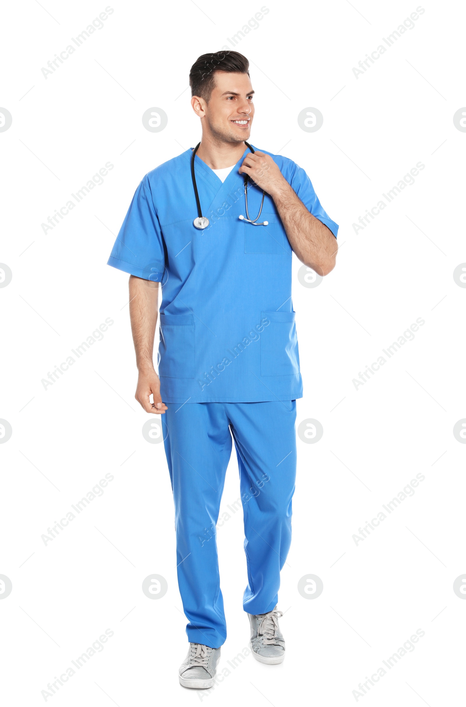 Photo of Full length portrait of medical doctor with stethoscope isolated on white