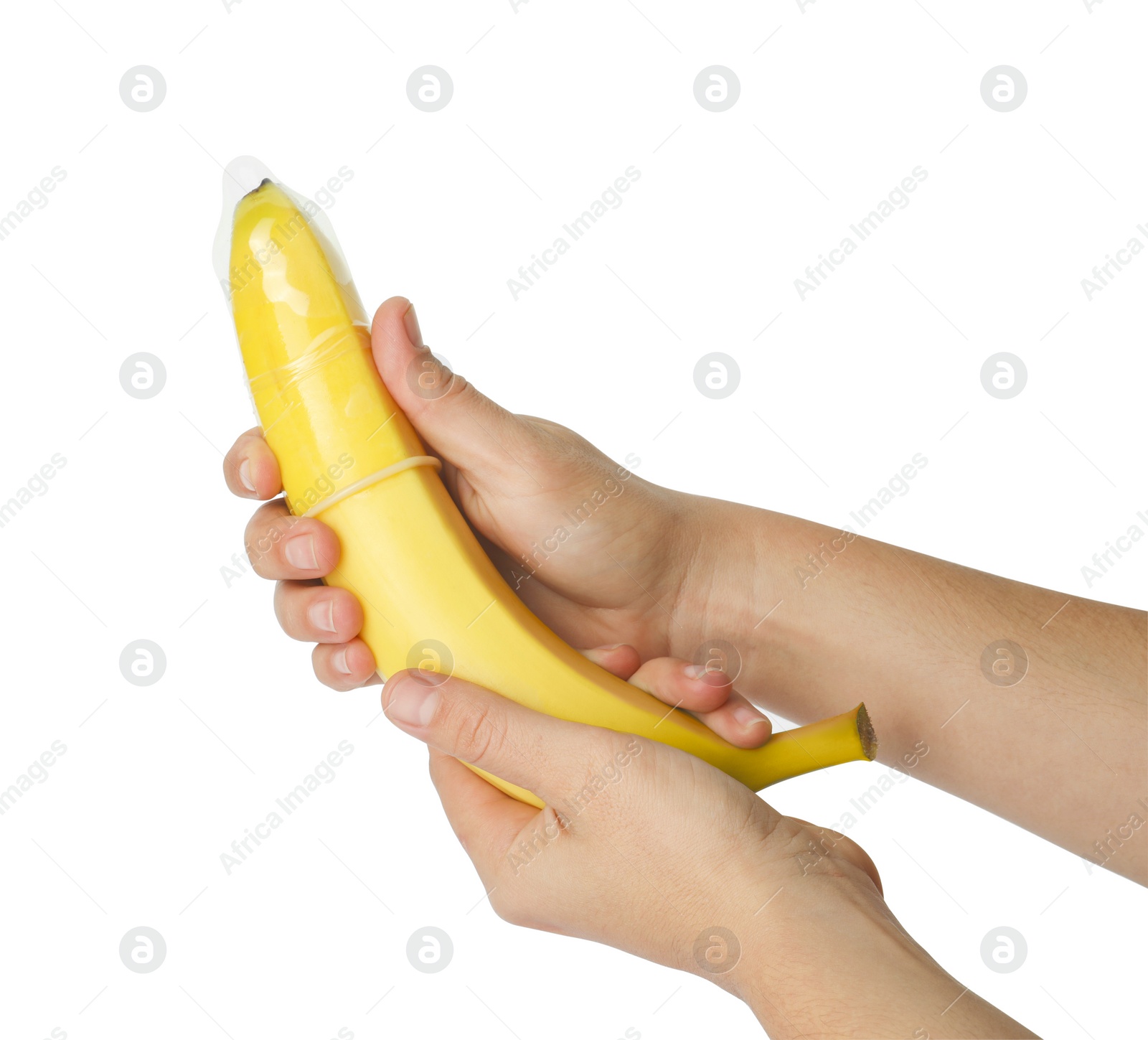 Photo of Woman holding banana in condom on white background, closeup. Safe sex concept