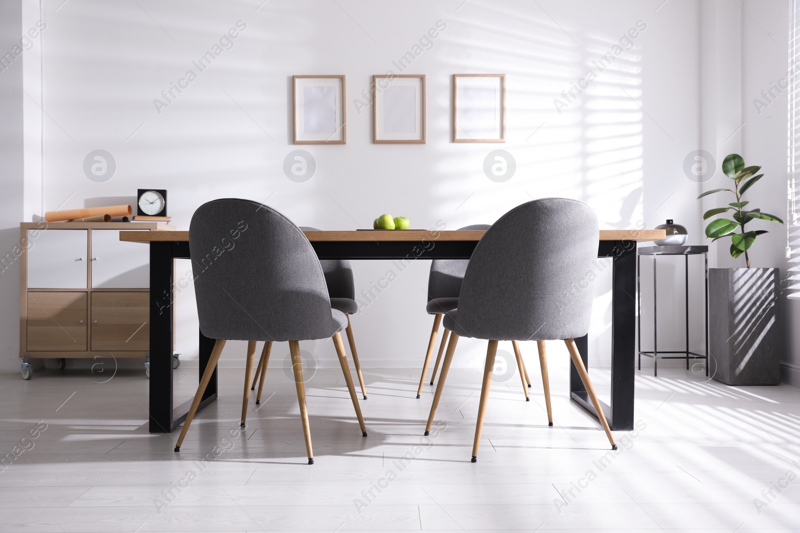 Photo of Stylish room interior with table and chairs. Idea for design