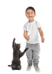 Happy little boy with his pet on white background