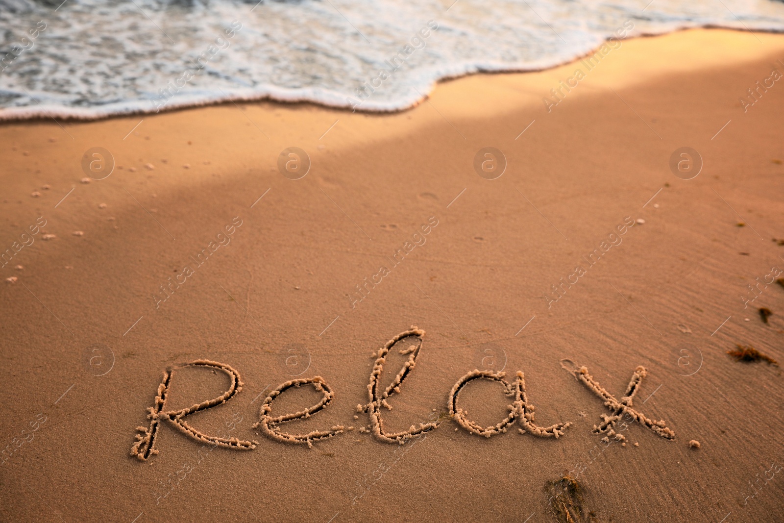 Photo of Sandy beach with written word Relax in summer