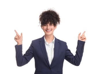 Beautiful businesswoman in suit pointing at something on white background