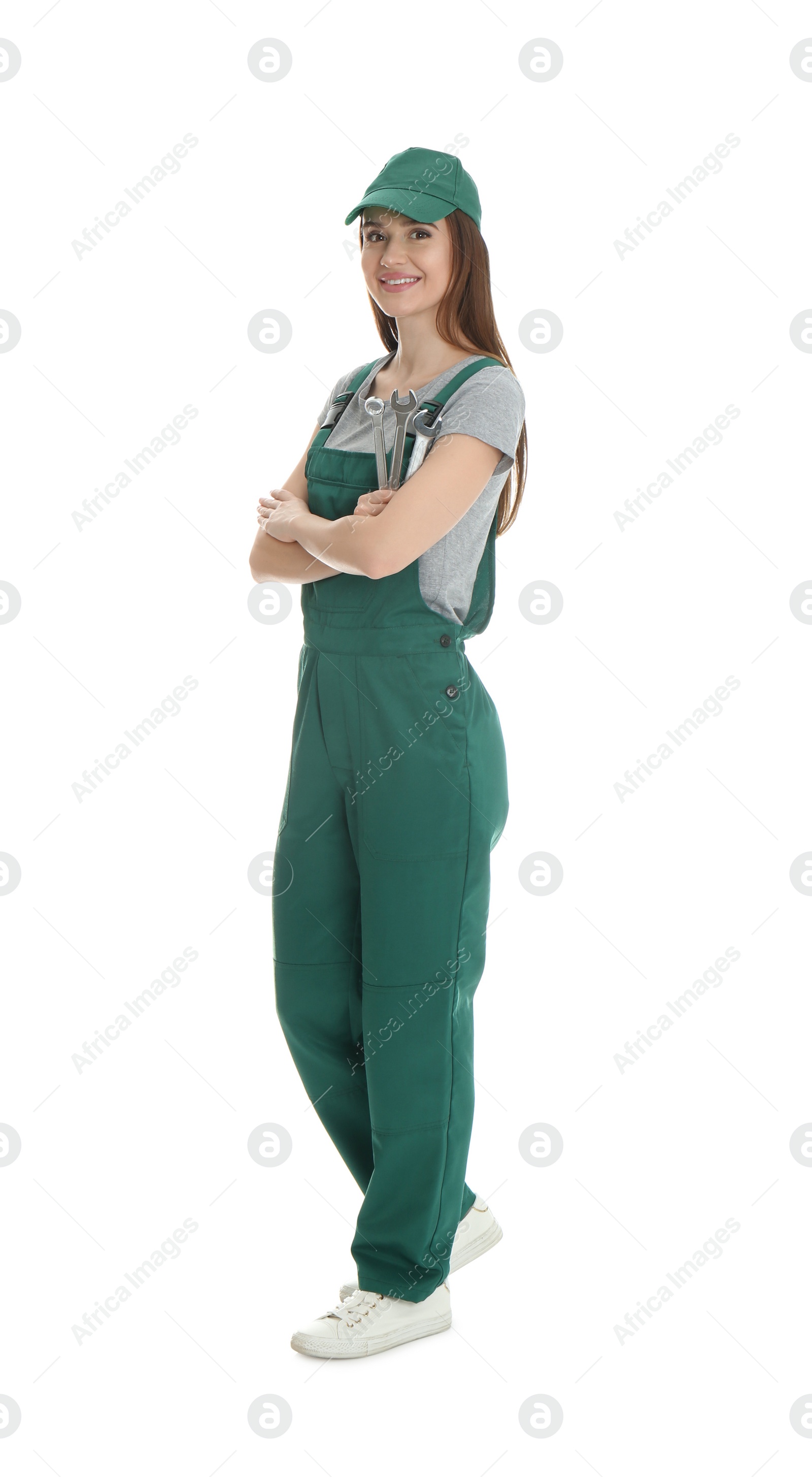 Photo of Full length portrait of professional auto mechanic with wrenches on white background