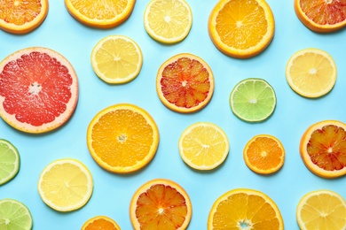 Different citrus fruits on color background, flat lay