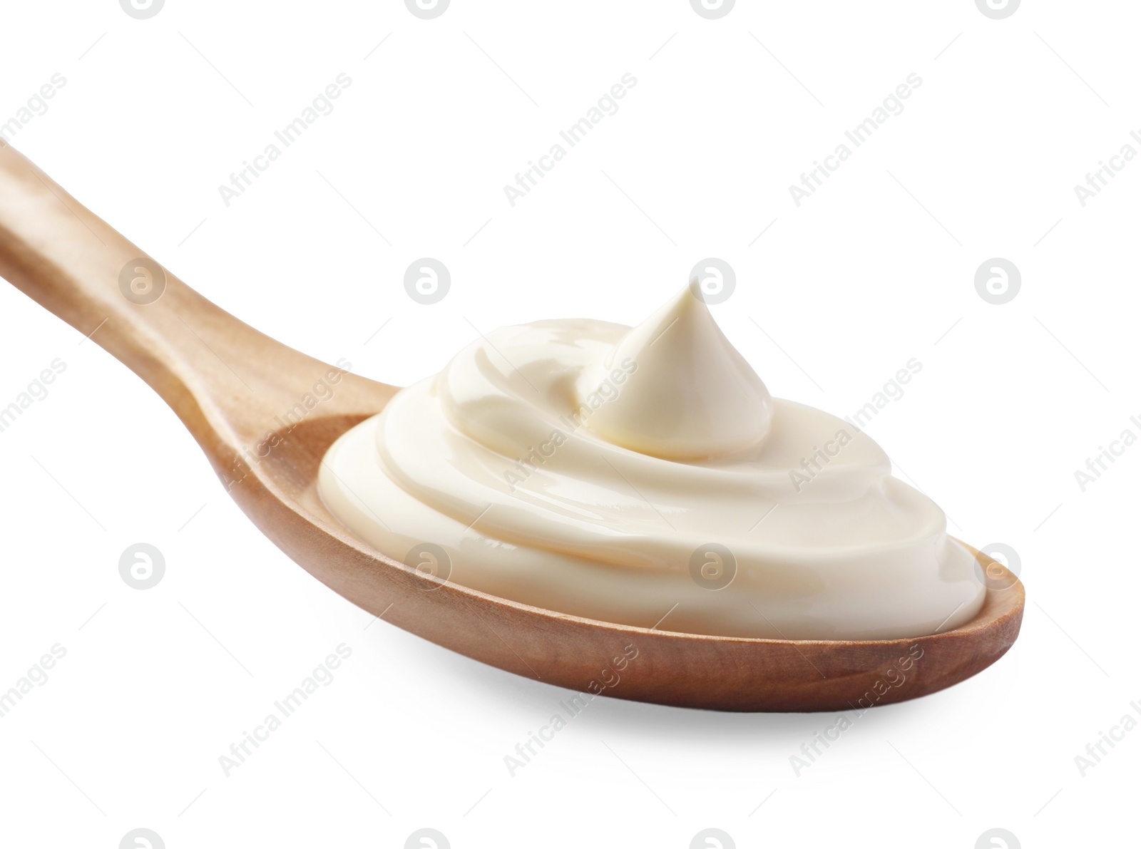 Photo of Natural yogurt in wooden spoon isolated on white