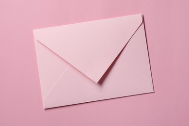 Photo of Letter envelope on pink background, top view