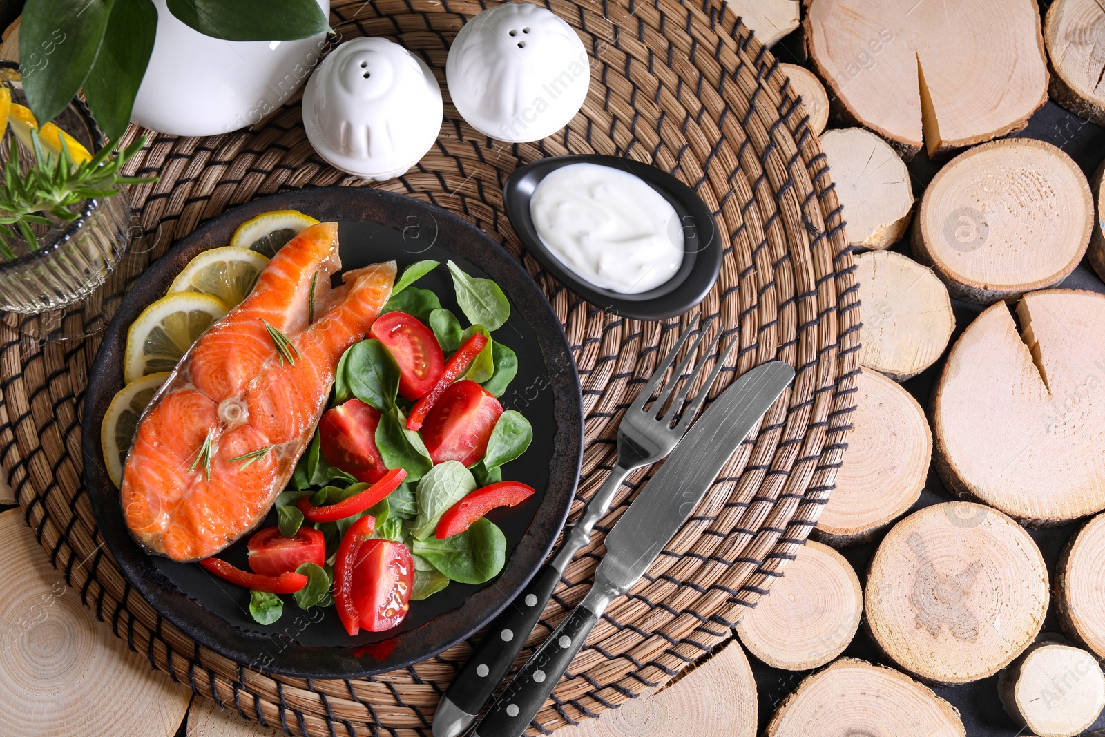 Photo of Healthy meal. Tasty grilled salmon with vegetables and lemon served on wooden table, flat lay. Space for text