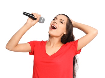 Young woman singing into microphone on white background. Christmas music