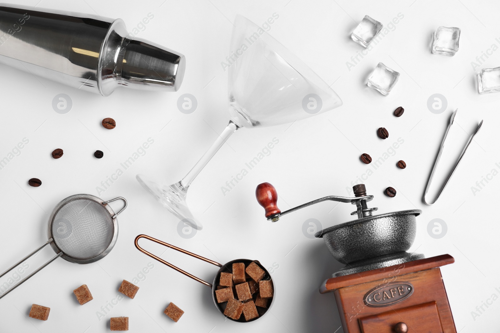 Photo of Flat lay composition with Espresso Martini ingredients  and bar equipment on white background. Alcohol cocktail