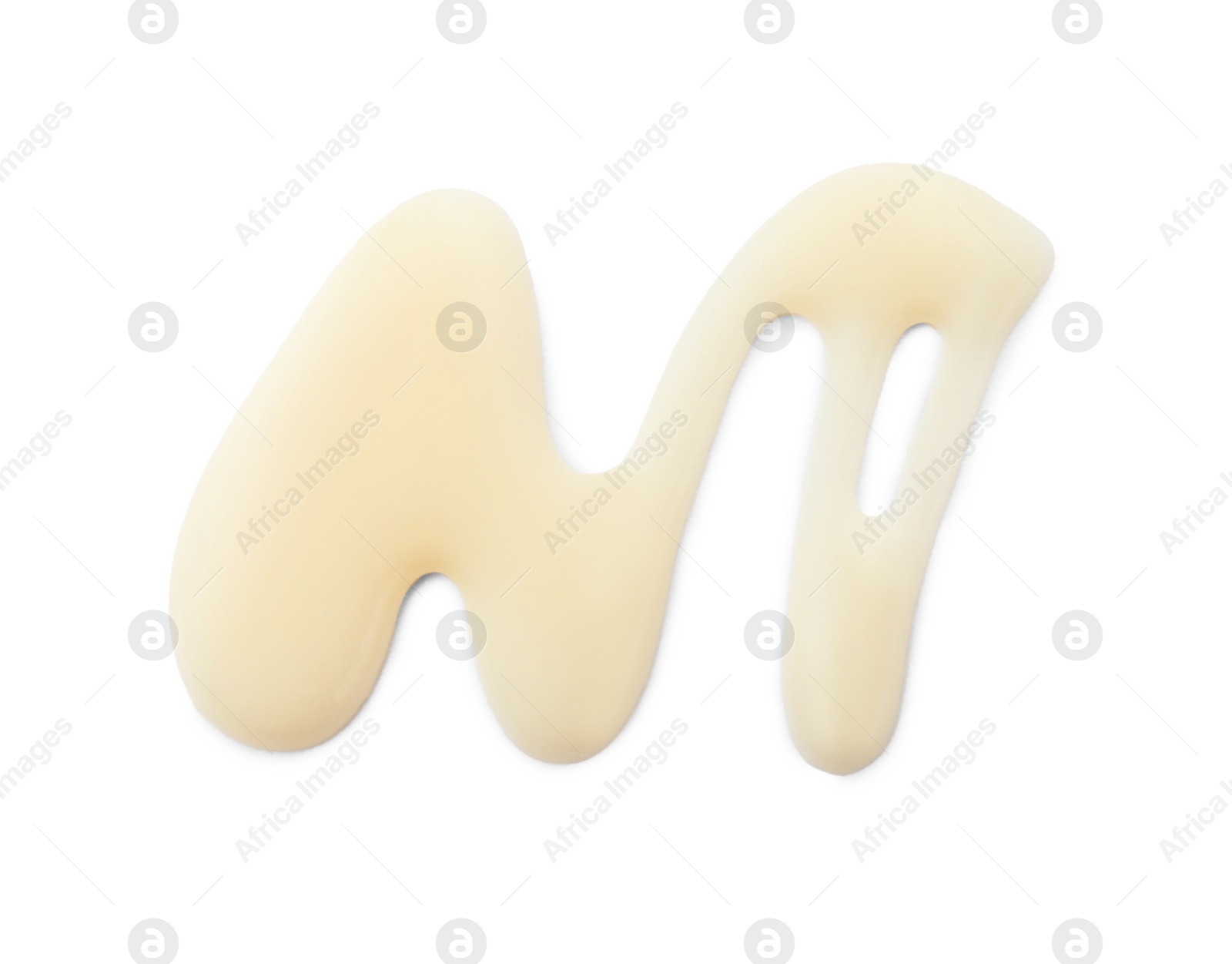 Photo of Spilled tasty condensed milk isolated on white, top view