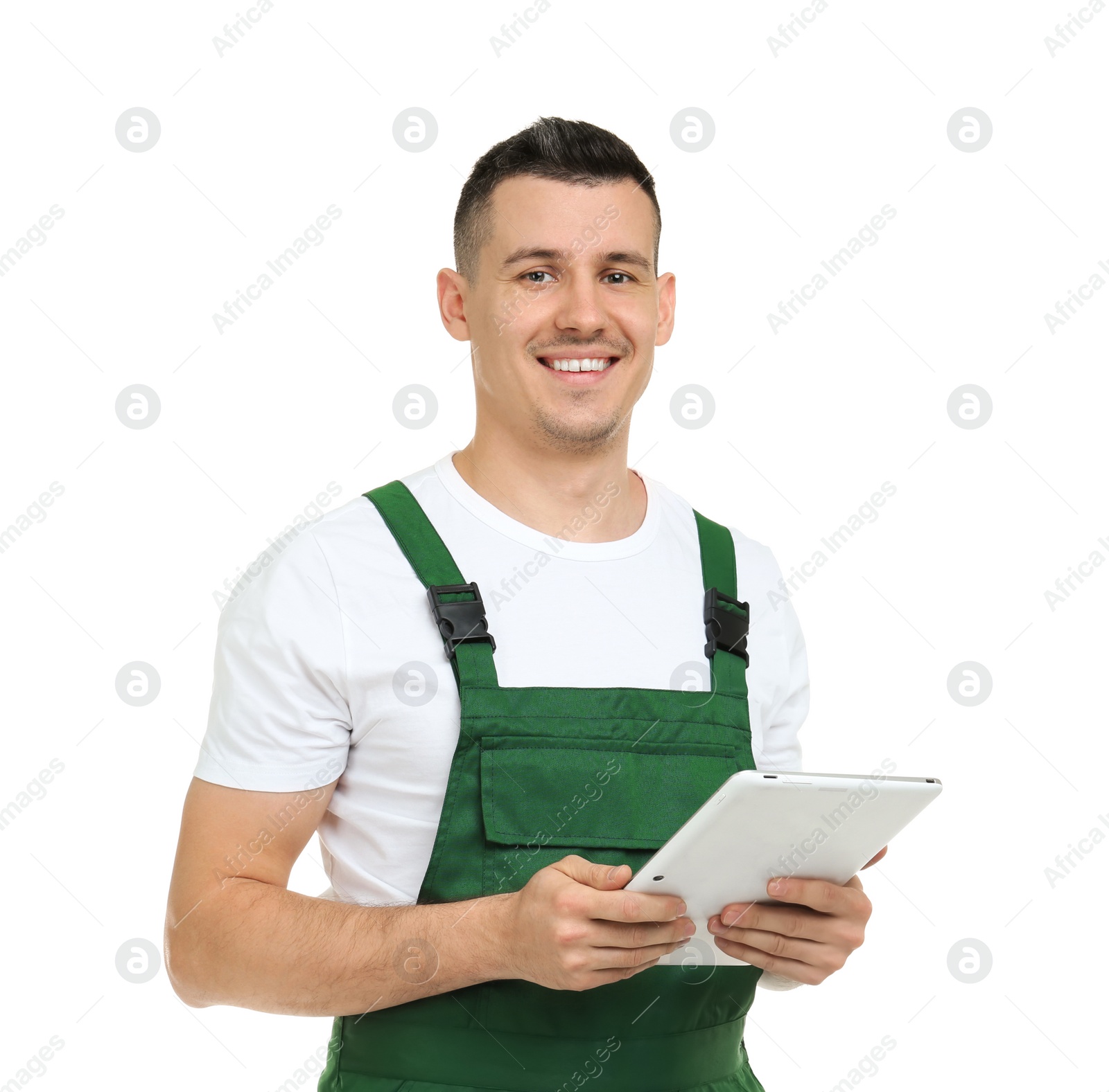 Photo of Young plumber with tablet computer on white background