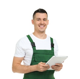 Young plumber with tablet computer on white background