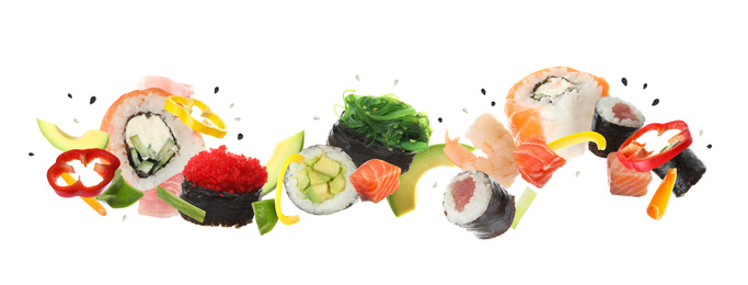 Different sushi rolls and ingredients on white background