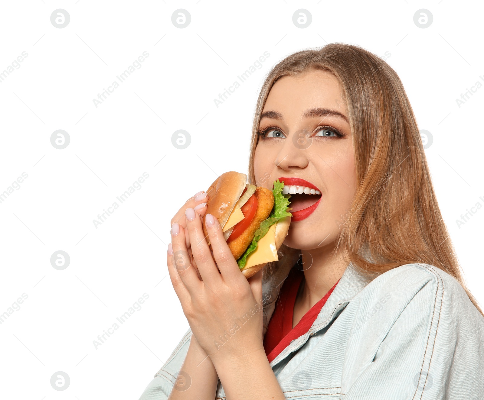 Photo of Pretty woman eating tasty burger isolated on white