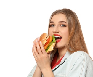 Pretty woman eating tasty burger isolated on white