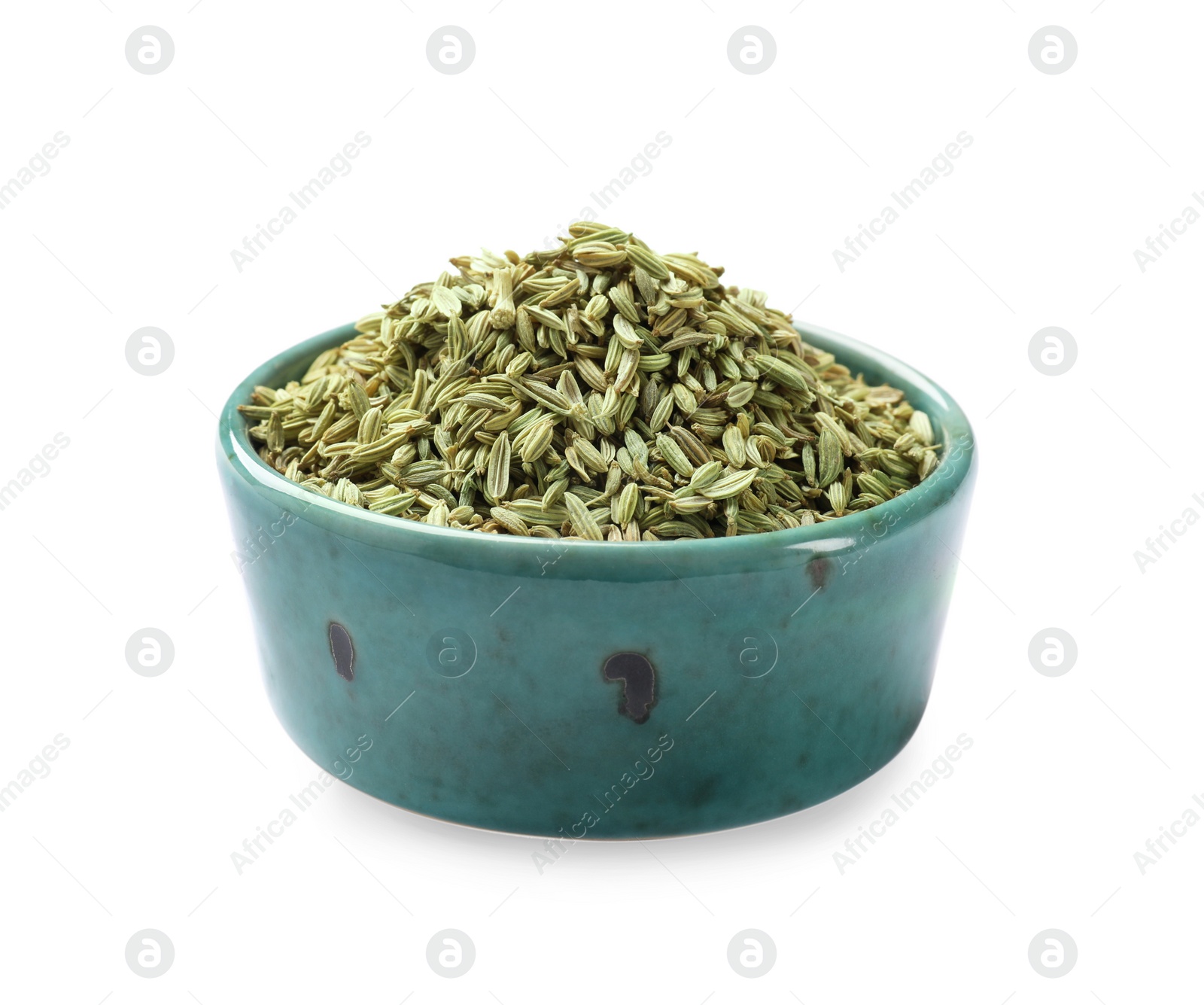 Photo of Dry fennel seeds in bowl isolated on white