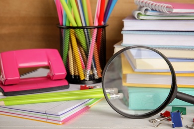 Photo of Different stationery on wooden table. Back to school