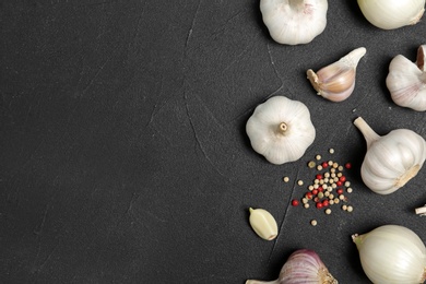 Photo of Flat lay composition with garlic, onion and space for text on table