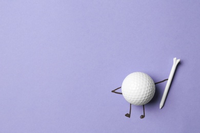 White ball as golf player on lilac background - creative image. Top view