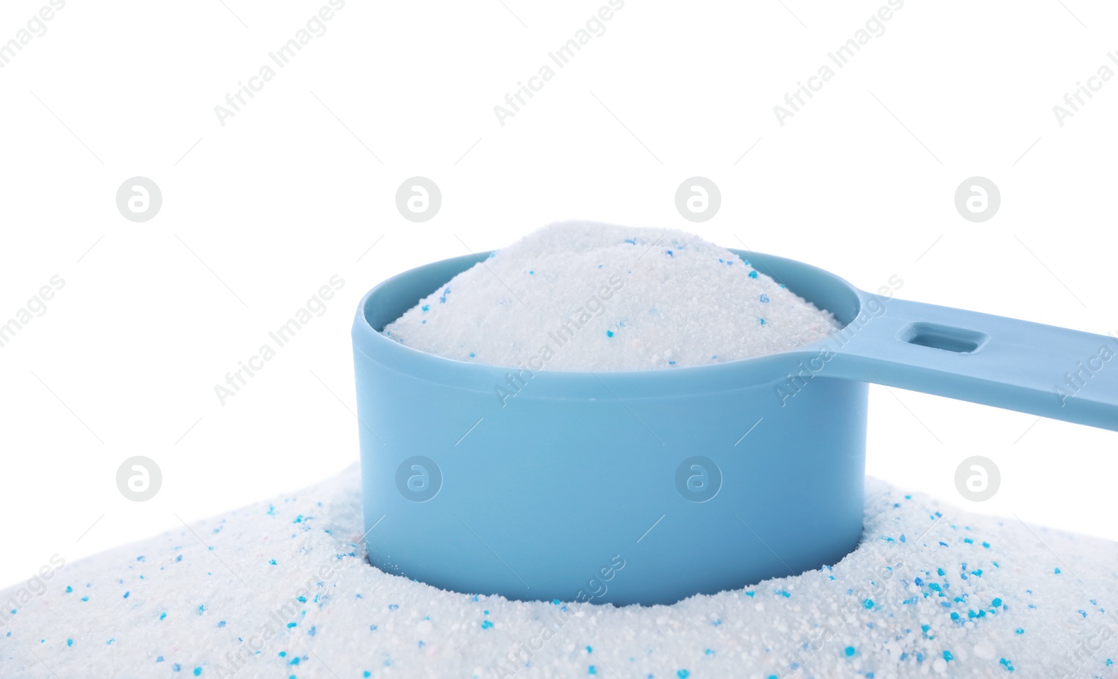 Photo of Measuring spoon with laundry powder on white background