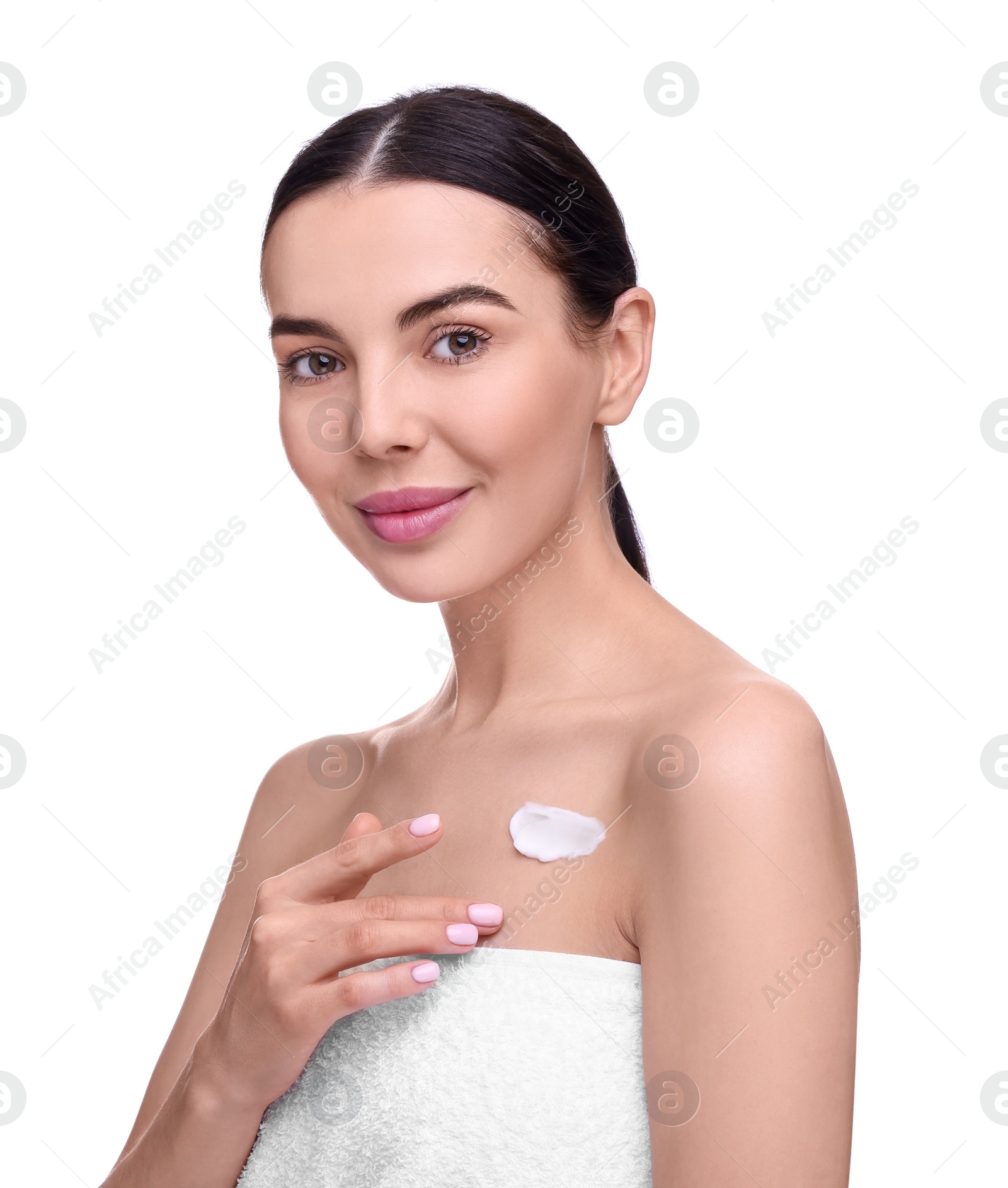 Photo of Beautiful woman with smear of body cream on her chest against white background