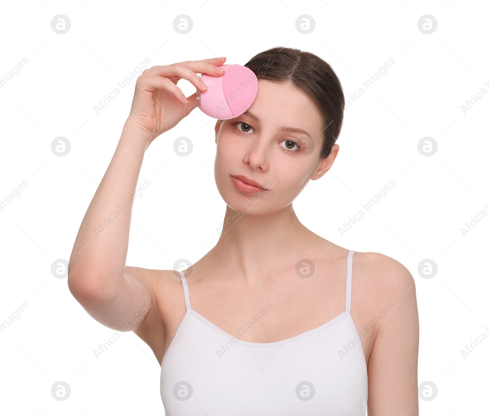 Photo of Washing face. Young woman with cleansing brush on white background