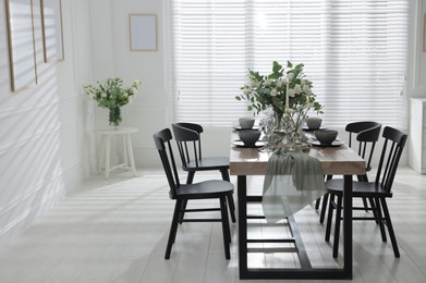 Photo of Festive table setting with beautiful tableware and decor indoors