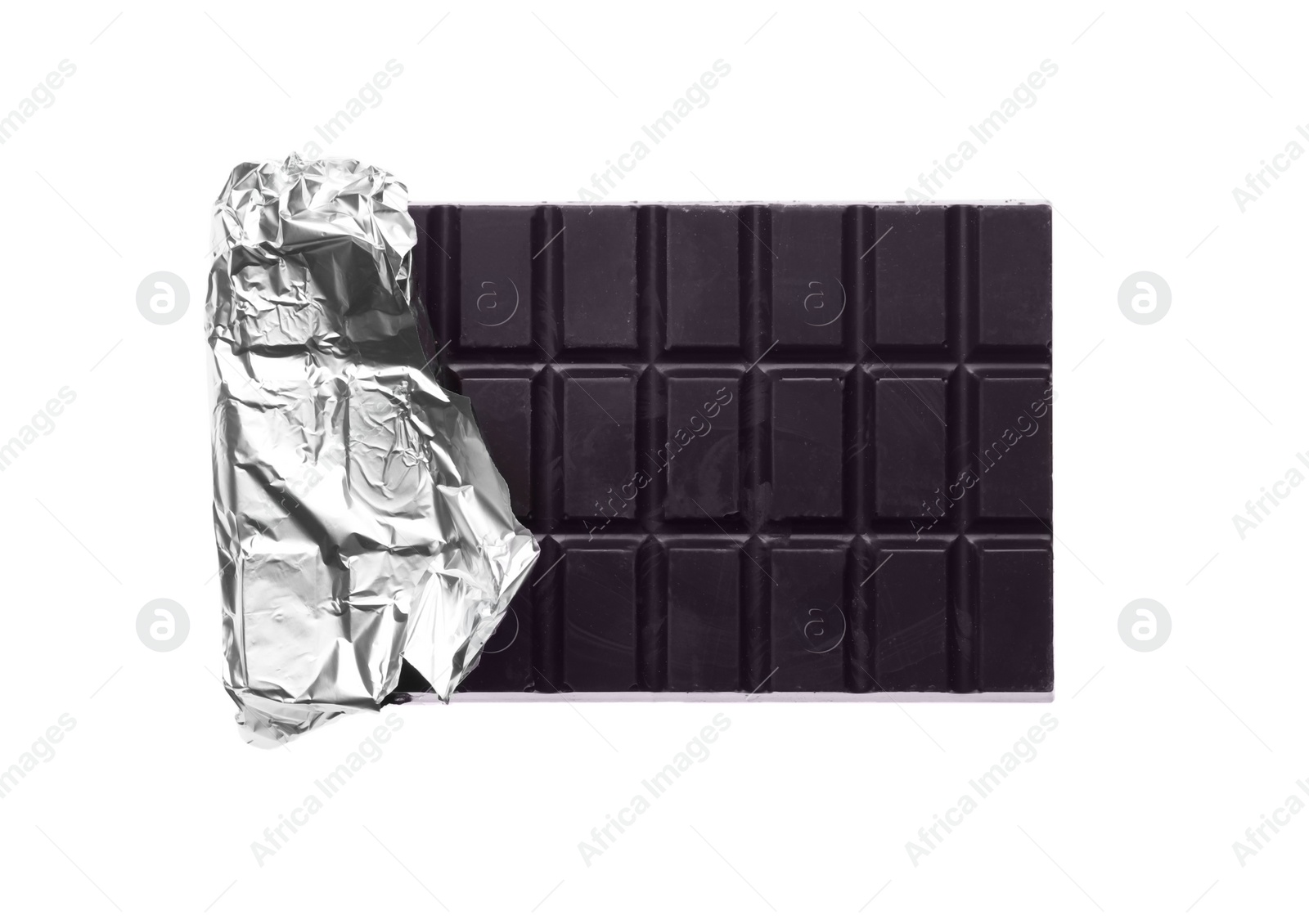 Photo of Delicious dark chocolate bar wrapped in foil isolated on white