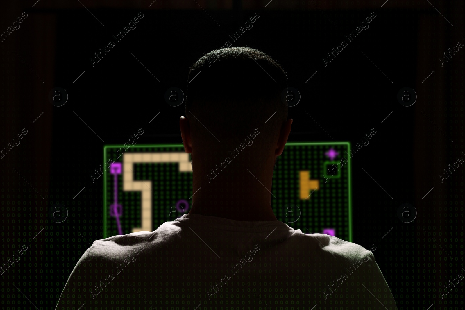 Image of Gaming disorder. Man playing on computer in darkness, back view