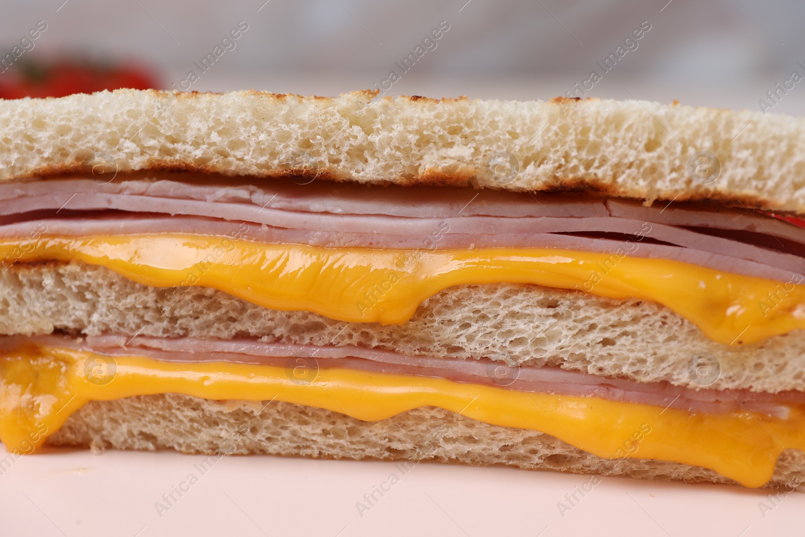 Delicious grilled sandwich with ham and cheese on table, closeup Photo of Delicious grilled sandwich with ham and cheese on table, closeup