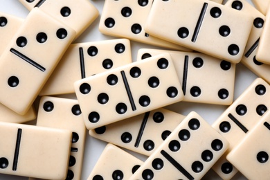 Photo of Set of classic domino tiles on white background, top view