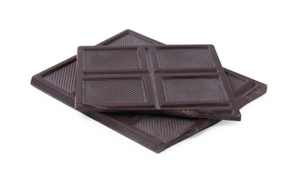 Pieces of tasty dark chocolate bar on isolated white