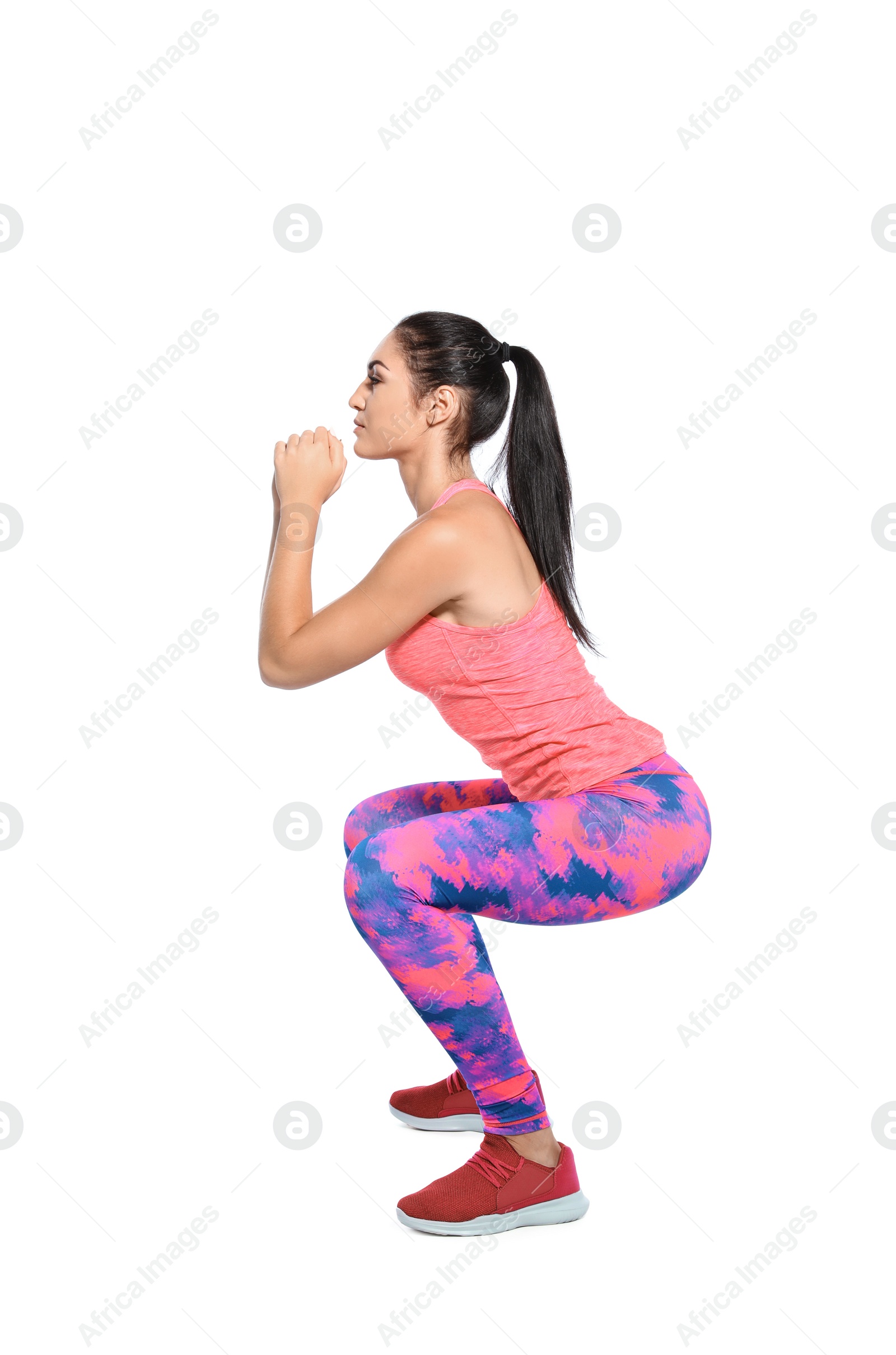 Photo of Young female runner exercising on white background