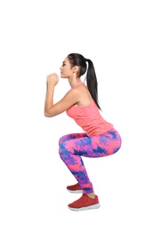 Photo of Young female runner exercising on white background