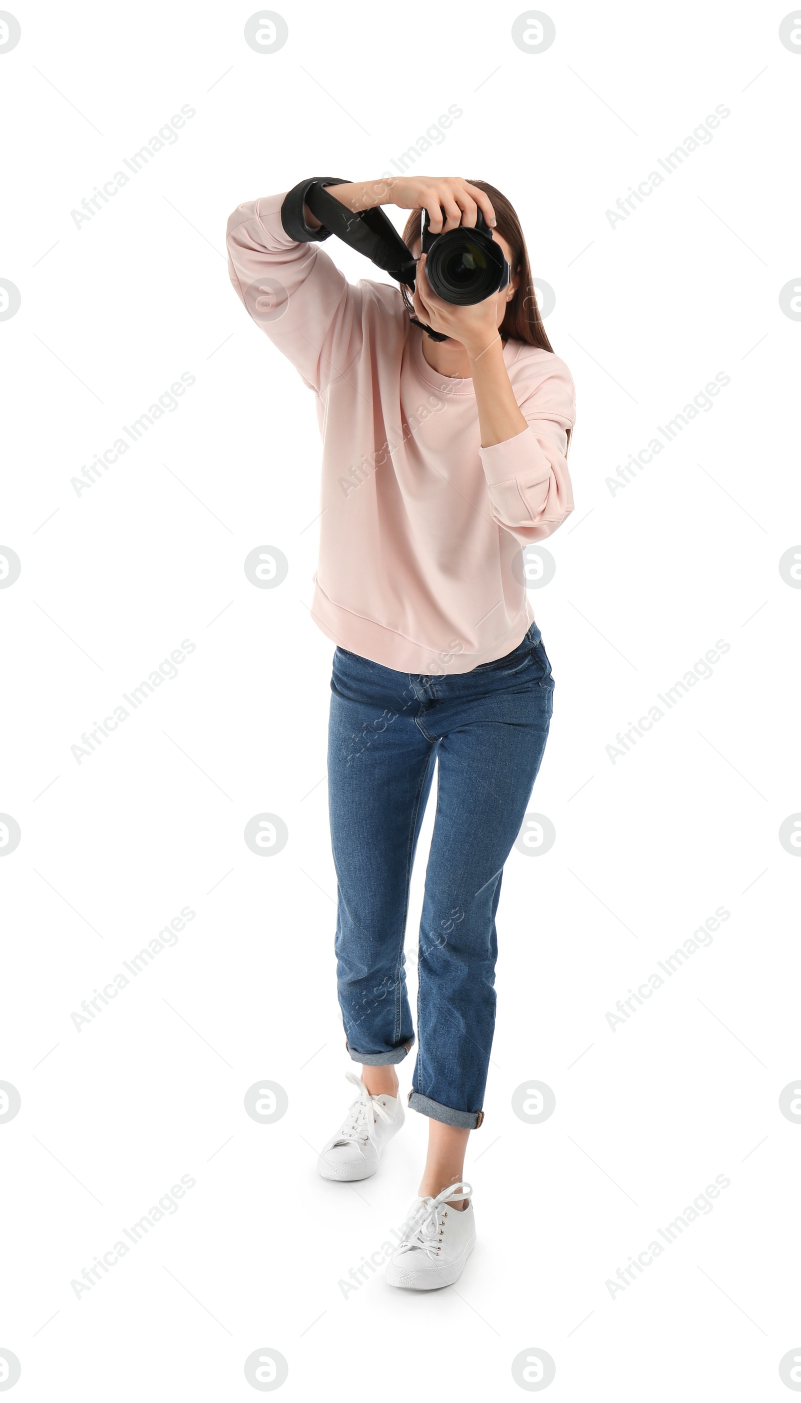 Photo of Professional photographer taking picture on white background