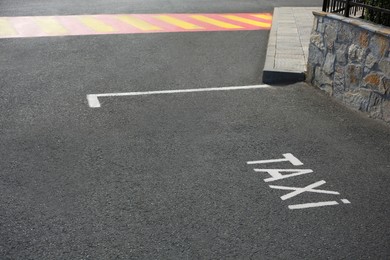 Photo of Empty outdoor parking lot for taxi on asphalt