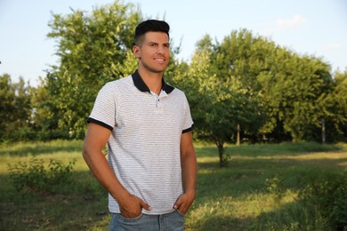 Handsome man in park on sunny day