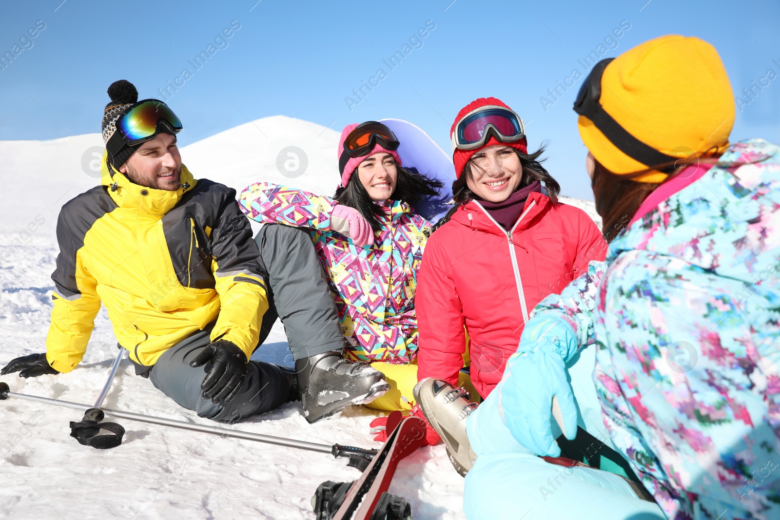 Photo of Group of friends with equipment at ski resort. Winter vacation